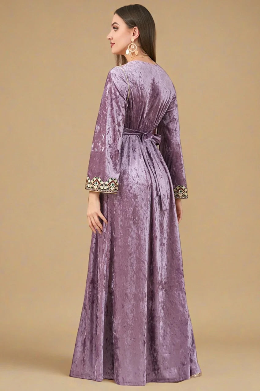 Angled back view of Zaynah pink Moroccan velvet kaftan in crushed velvet