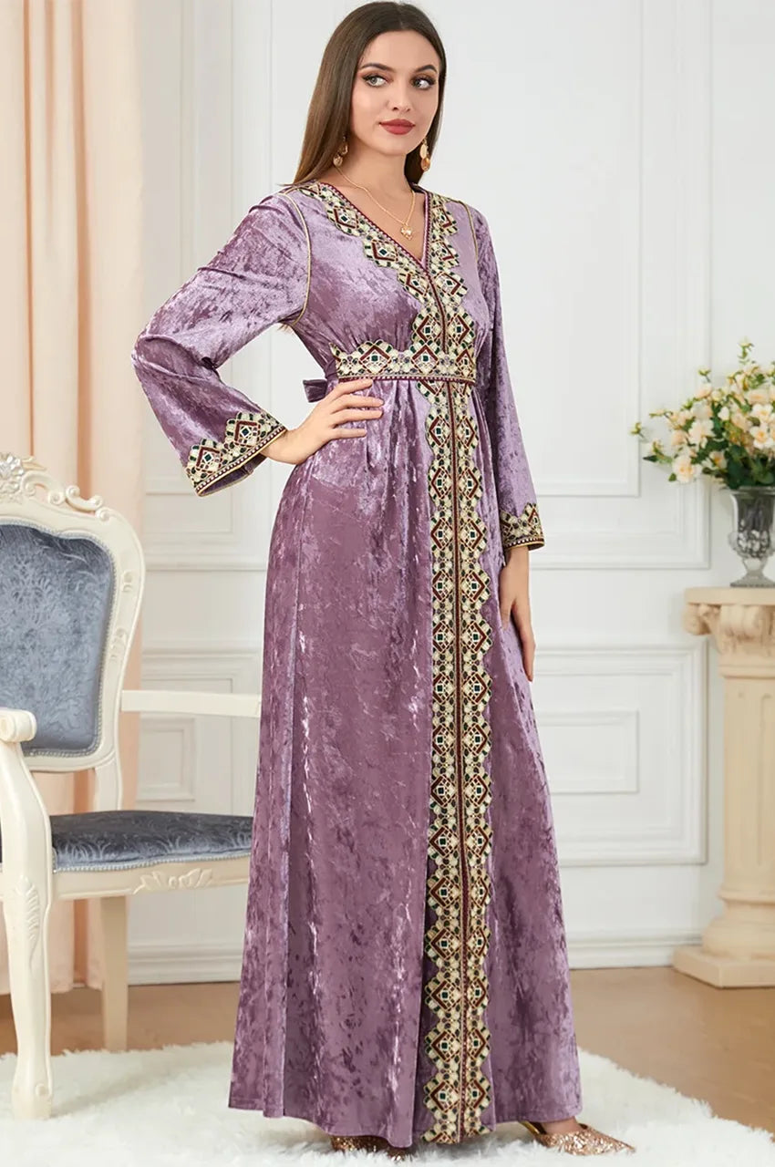 Zaynah pink Moroccan velvet kaftan worn indoors, full-length front view