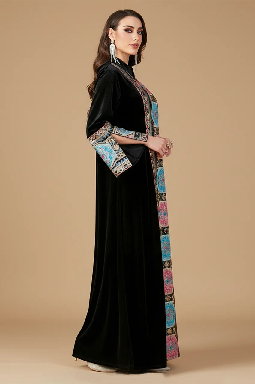 Side profile of Zeina black velvet dress highlighting wide kimono sleeves.