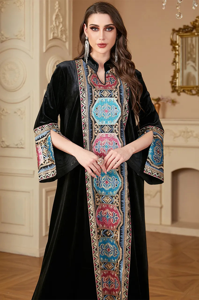 Close-up of Aztec geometric embroidery on the neckline of the Zeina kaftan.