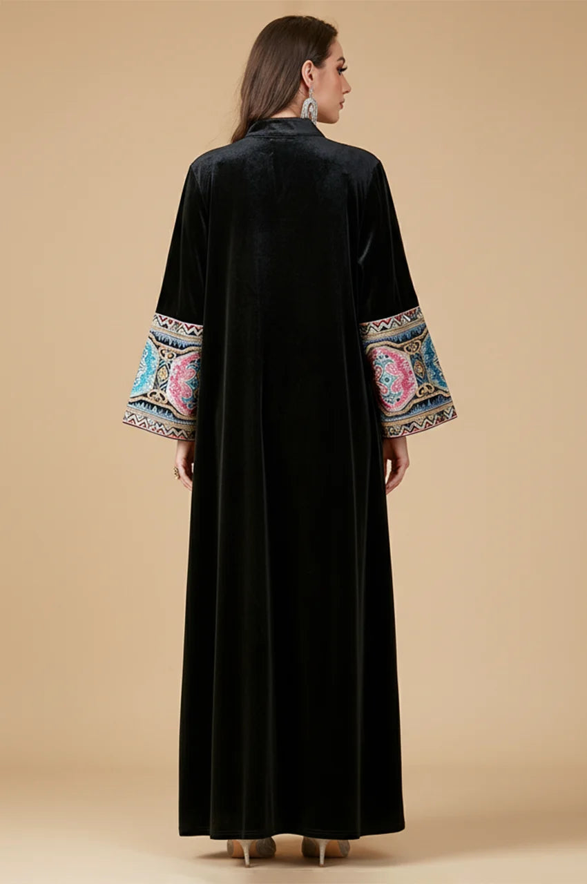 Rear view of Zeina black kaftan showing elegant floor-length velvet drape.