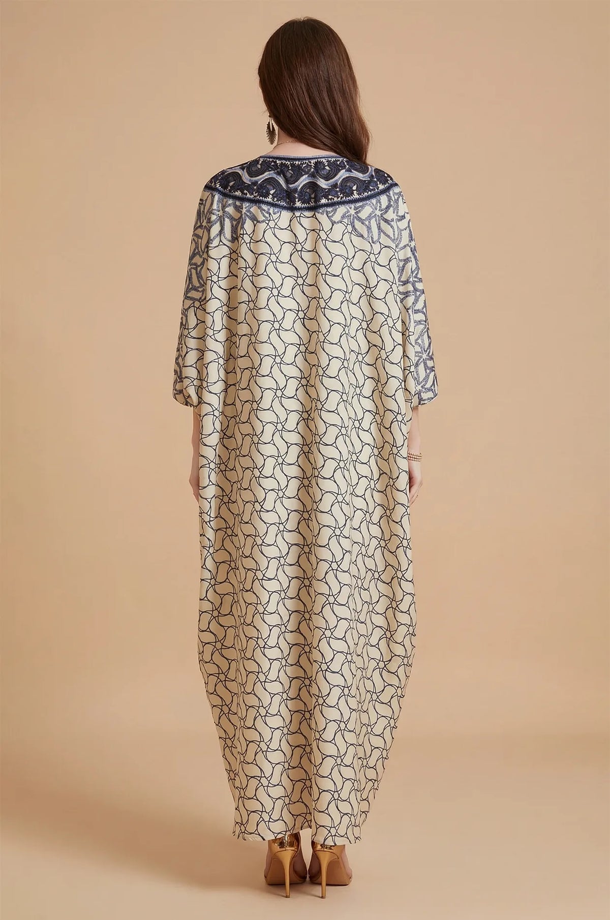 Back view of the Zelia ivory kaftan showcasing the geometric print.