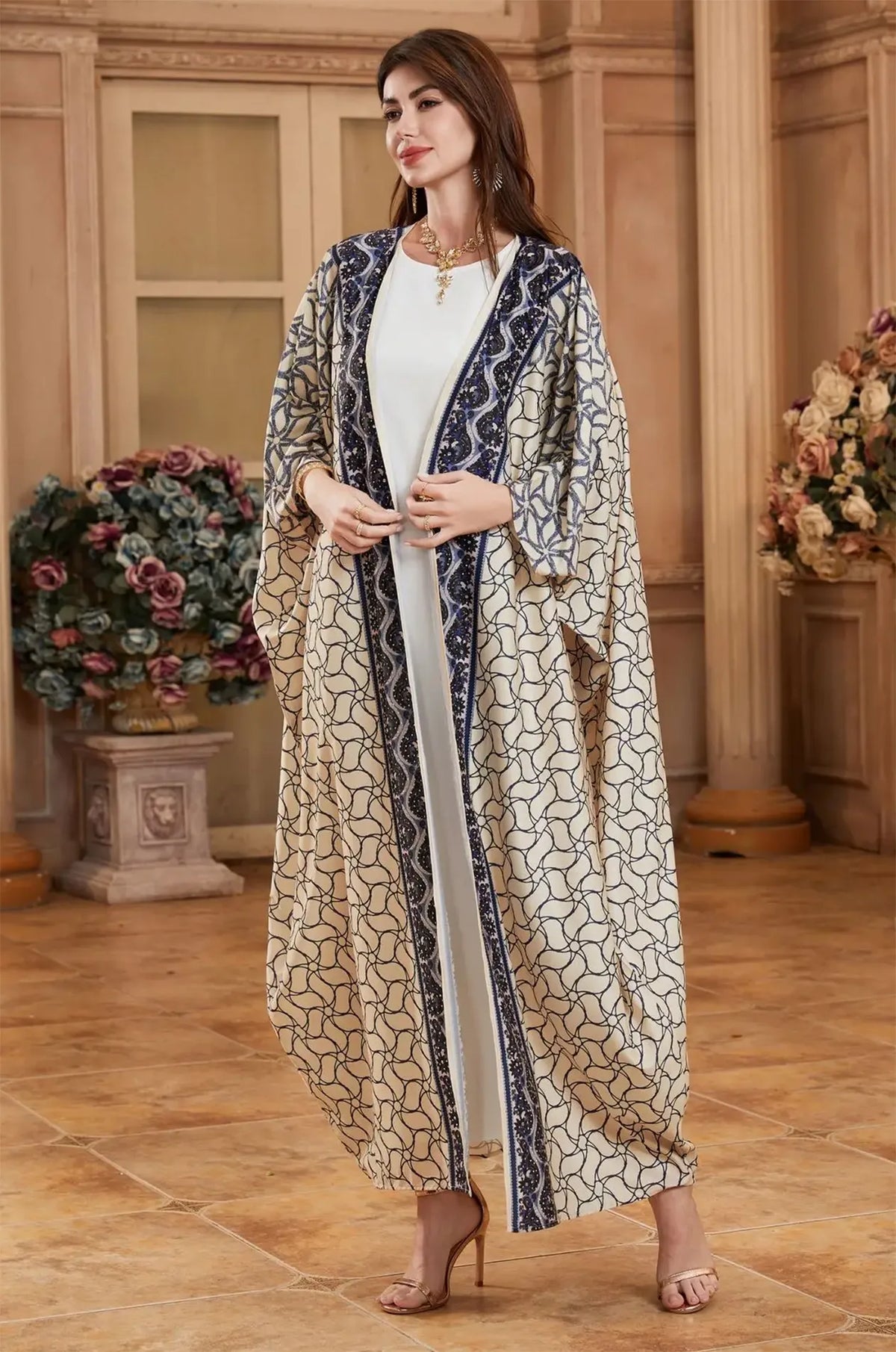 Close-up of the Zelia ivory kaftan bodice and decorative navy trim.