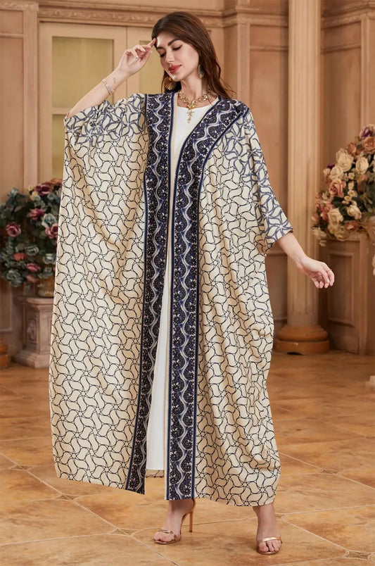High-fashion pose of the Zelia ivory kaftan suitable for wedding guest attire.
