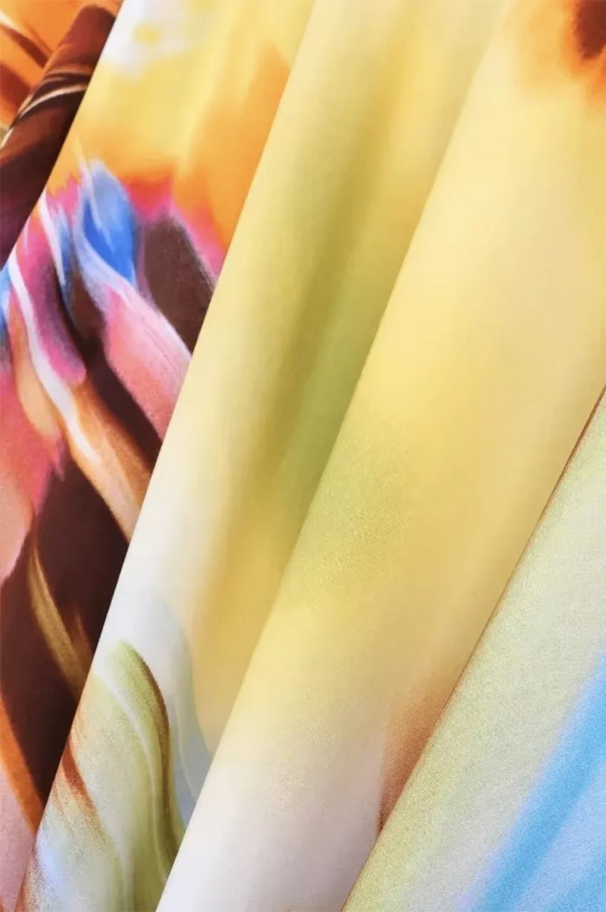 Close-up fabric detail of Zyra psychedelic kaftan with vibrant colors